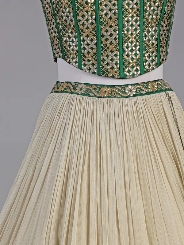 Green and cream silk lehenga choli with resham detailing