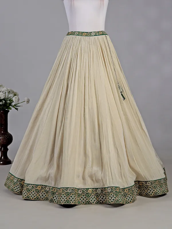 Green and cream silk lehenga choli with resham detailing