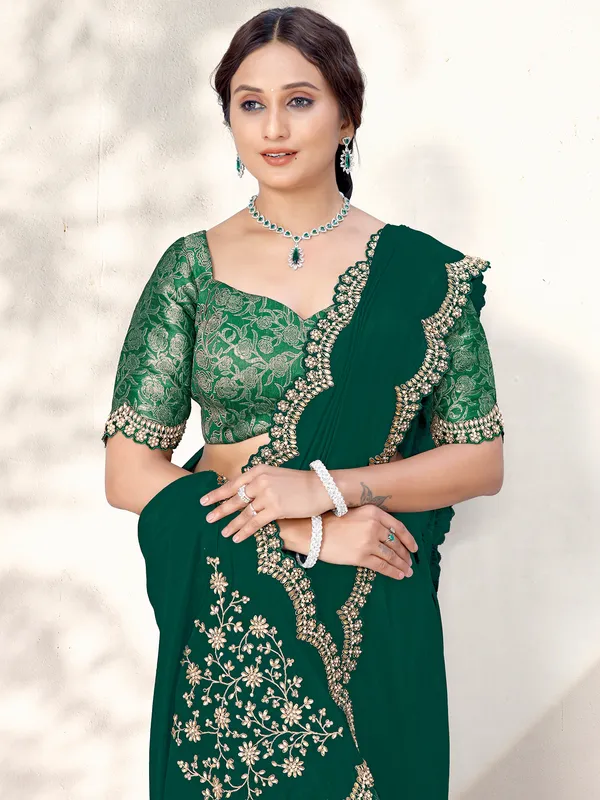 Green crepe saree with stones and resham embroidery