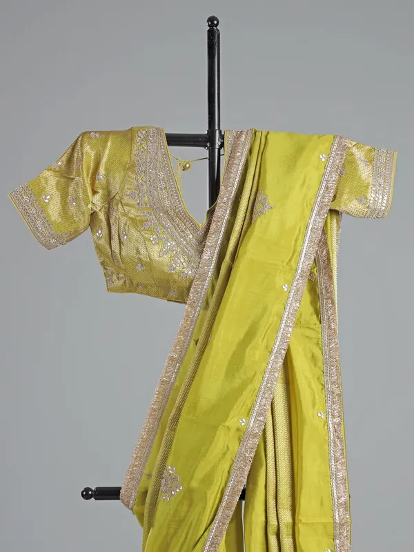 Green dola silk saree with zardosi & gota accents