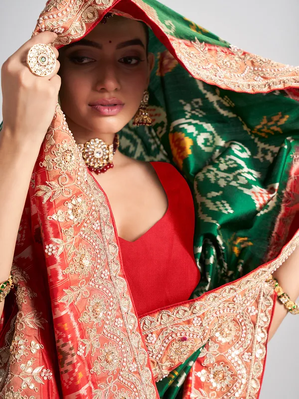 Green hyderabadi patola silk saree with contrast border work
