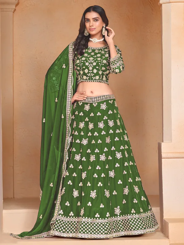 Green organza lehenga choli with zari and sequin embellishment