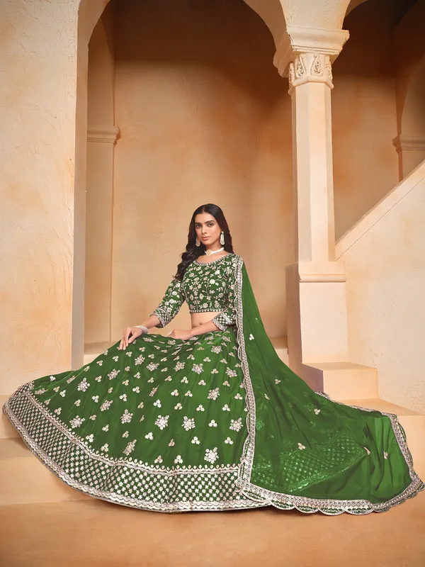 Green organza lehenga choli with zari and sequin embellishment
