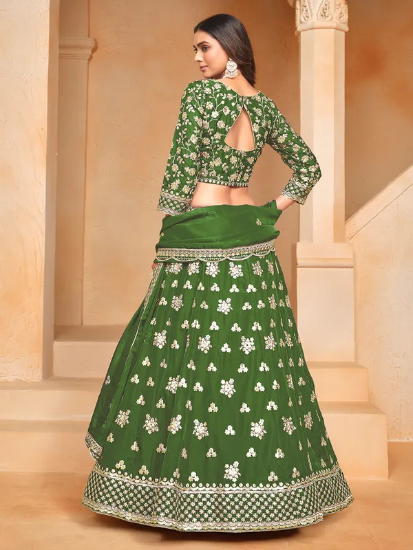 Green organza lehenga choli with zari and sequin embellishment