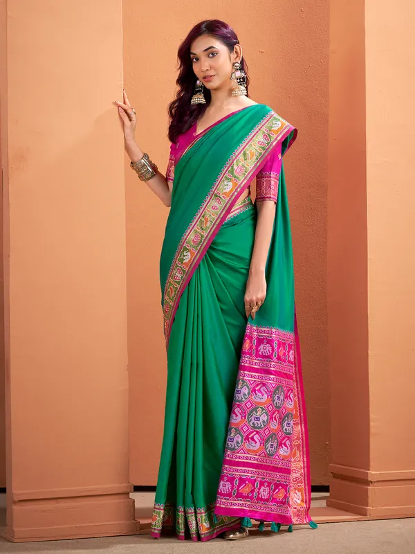 Green patola silk saree with festive radiance