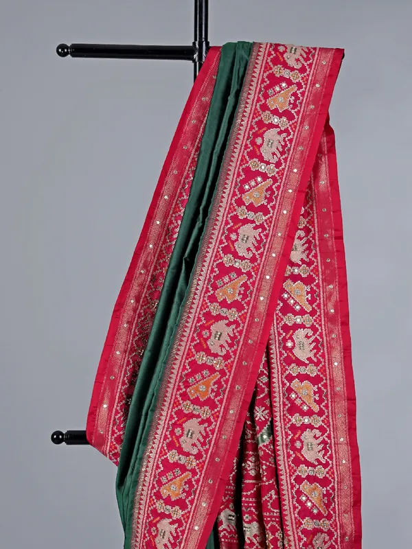 Green patola silk saree with pearls detailing