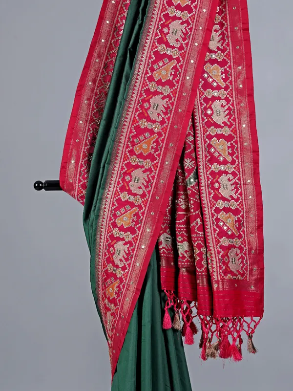 Green patola silk saree with pearls detailing