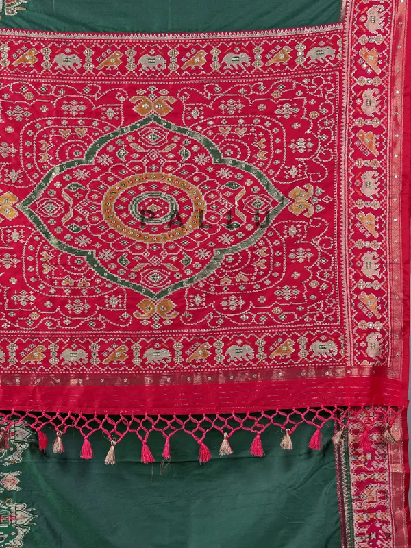 Green patola silk saree with pearls detailing