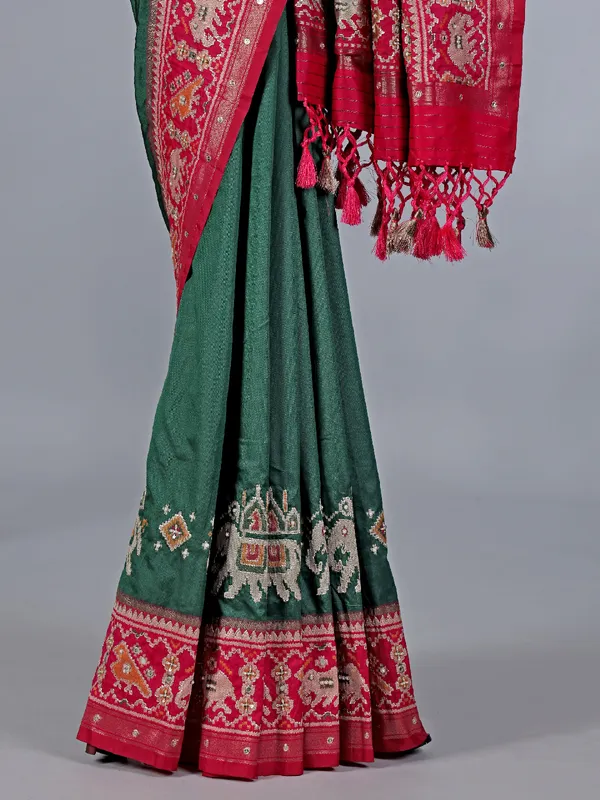 Green patola silk saree with pearls detailing