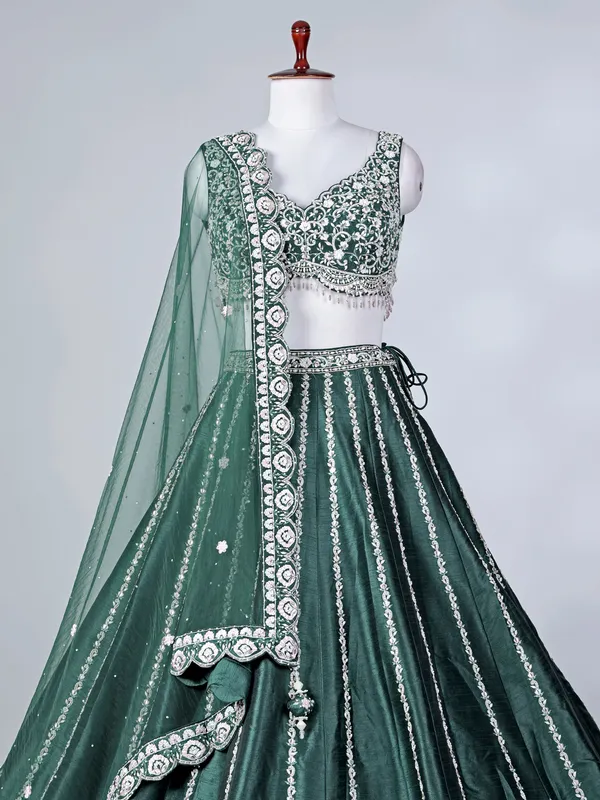 Green raw silk lehenga choli with stone work