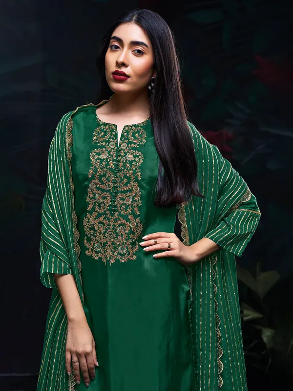 Green salwar suit in silk with dupatta for festive wear