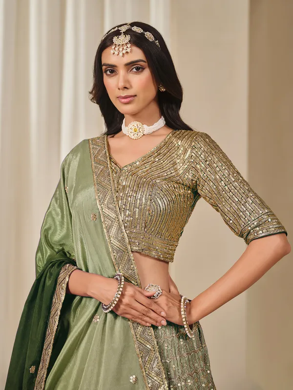 Green sequins worked silk lehenga choli