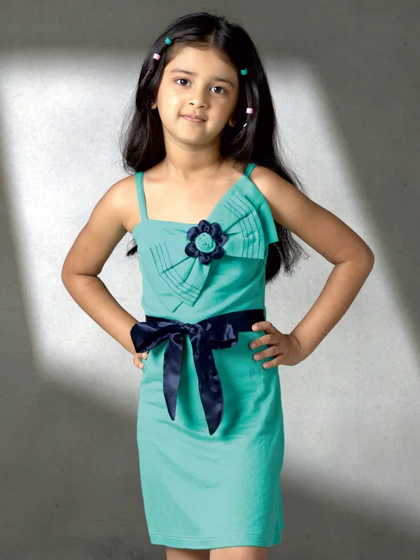 Green silk mini dress with bow charm