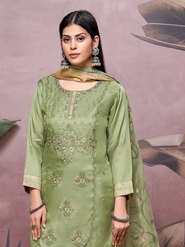 Green silk salwar suit with embroidery