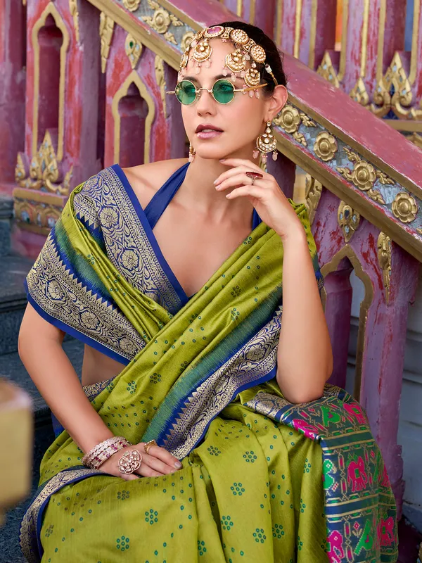 Green silk saree featuring tussar weave and zari