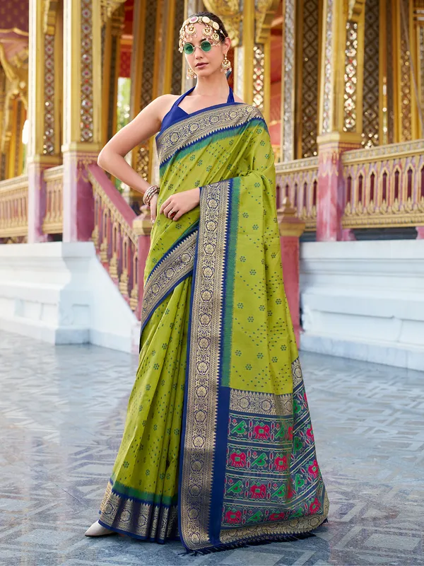 Green silk saree featuring tussar weave and zari