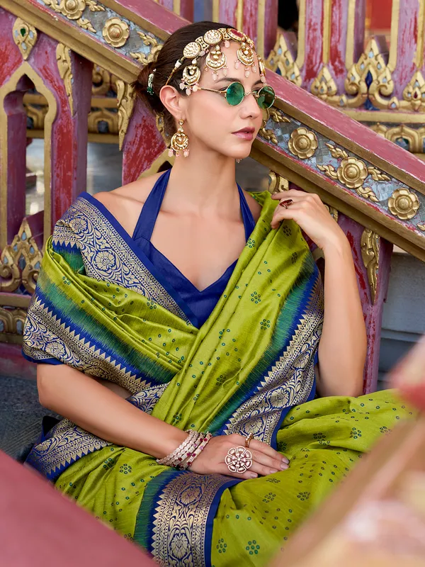 Green silk saree featuring tussar weave and zari
