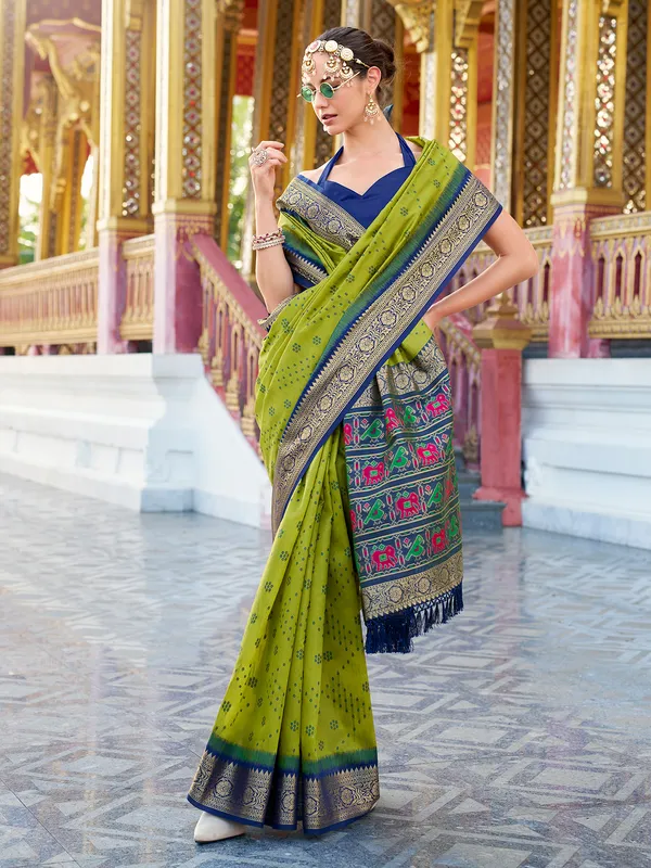Green silk saree featuring tussar weave and zari