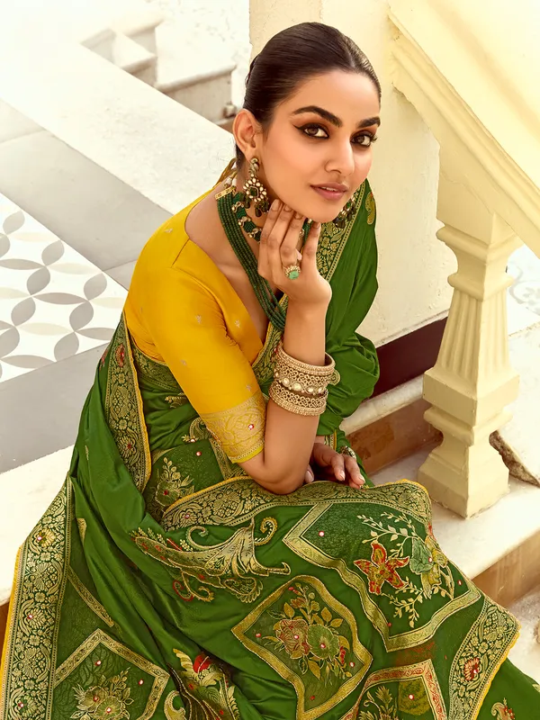 Green silk saree with colorful motif weaving