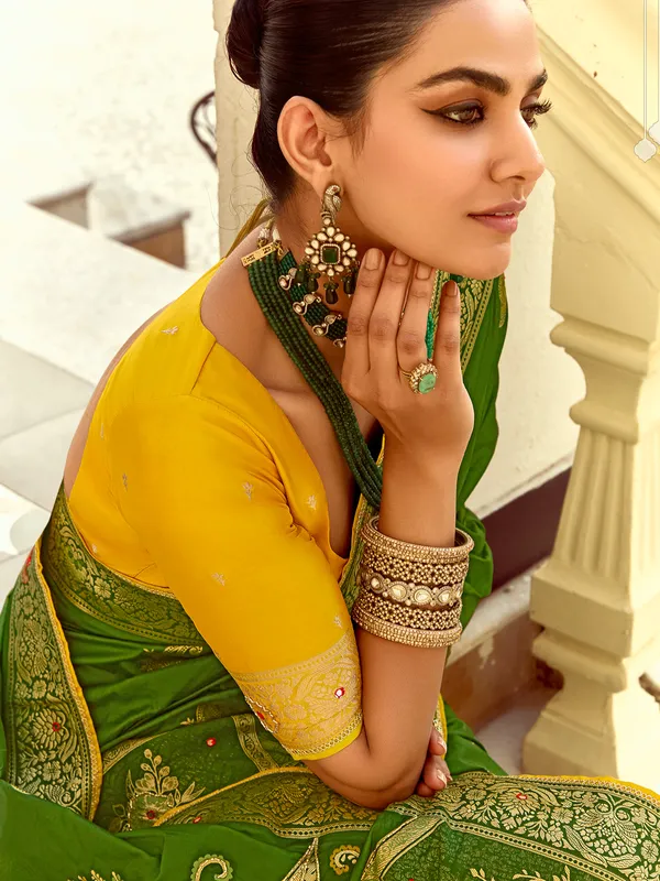 Green silk saree with colorful motif weaving