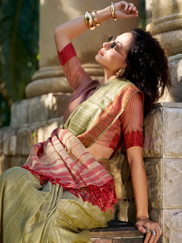 Green silk saree with radiant zari weave