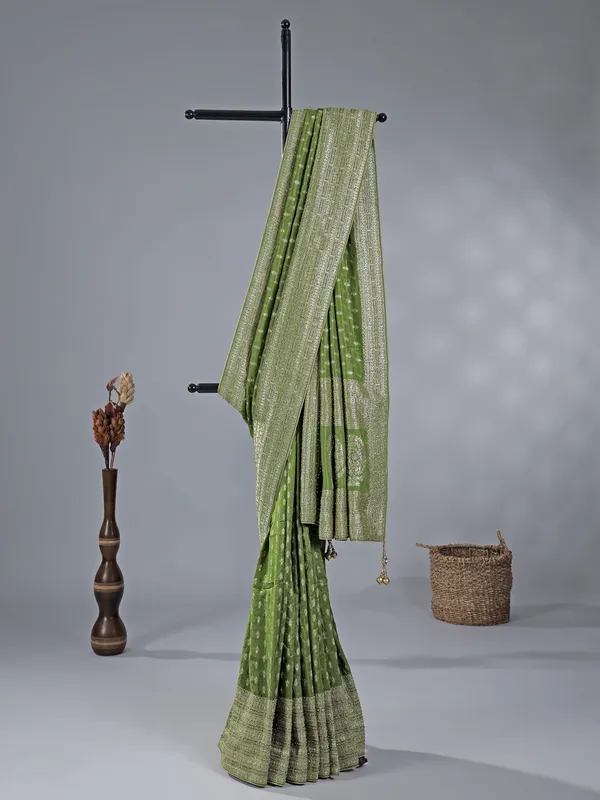 Green silk saree with rich zari motifs