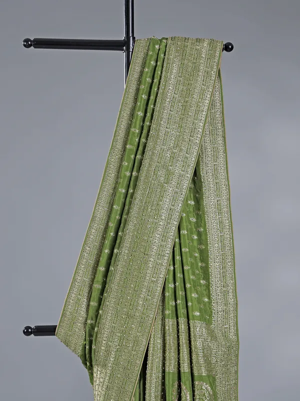 Green silk saree with rich zari motifs