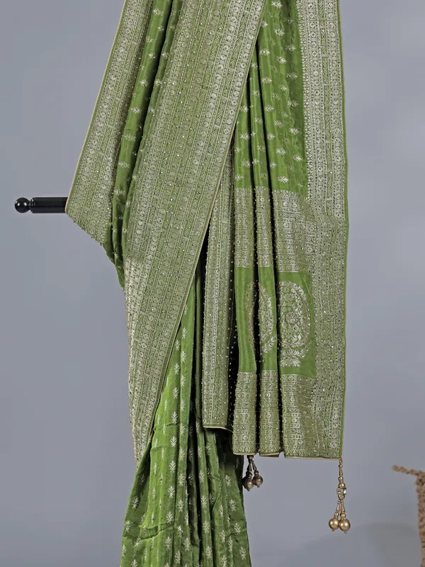 Green silk saree with rich zari motifs