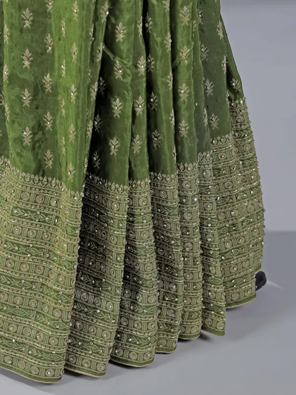 Green silk saree with rich zari motifs