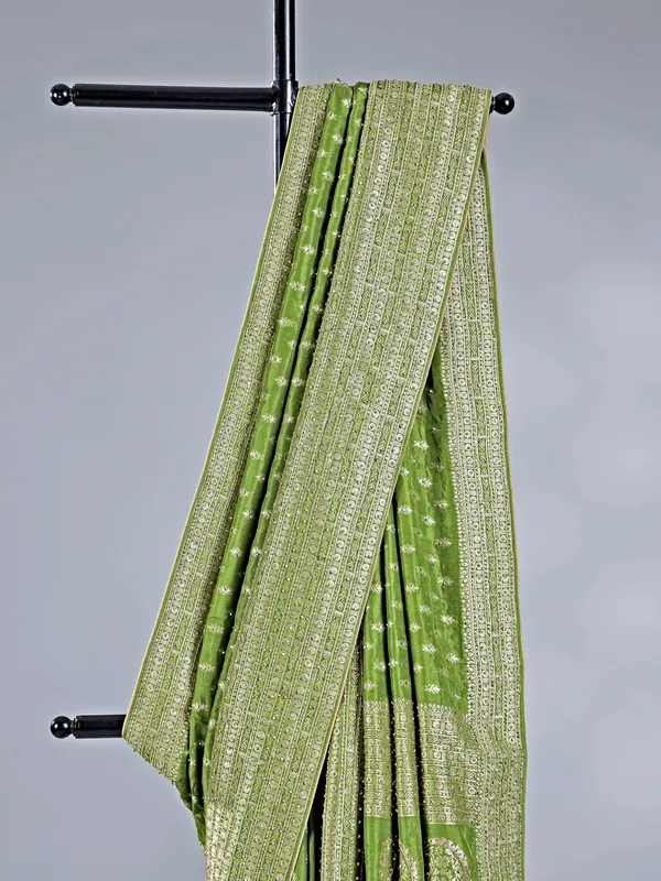 Green silk saree with rich zari motifs