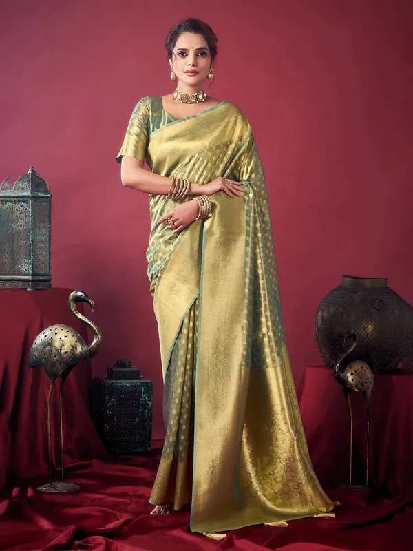 Green silk saree with zari glow