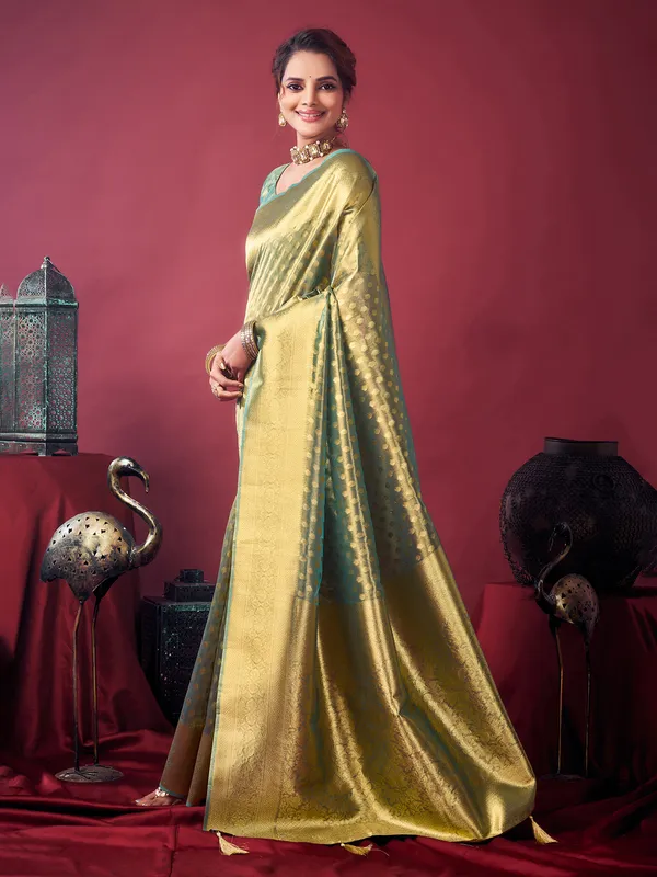 Green silk saree with zari glow