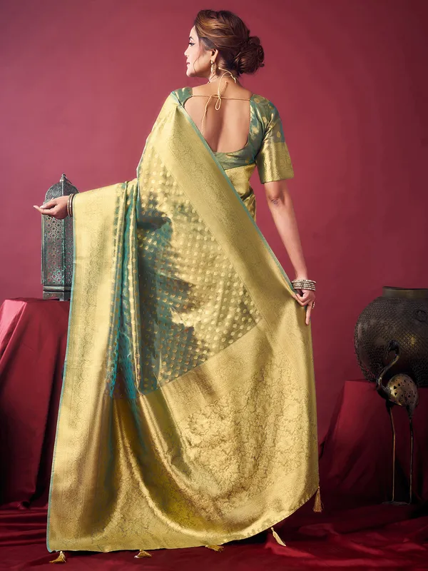 Green silk saree with zari glow