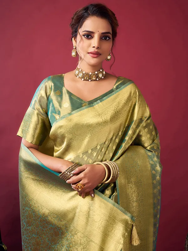 Green silk saree with zari glow
