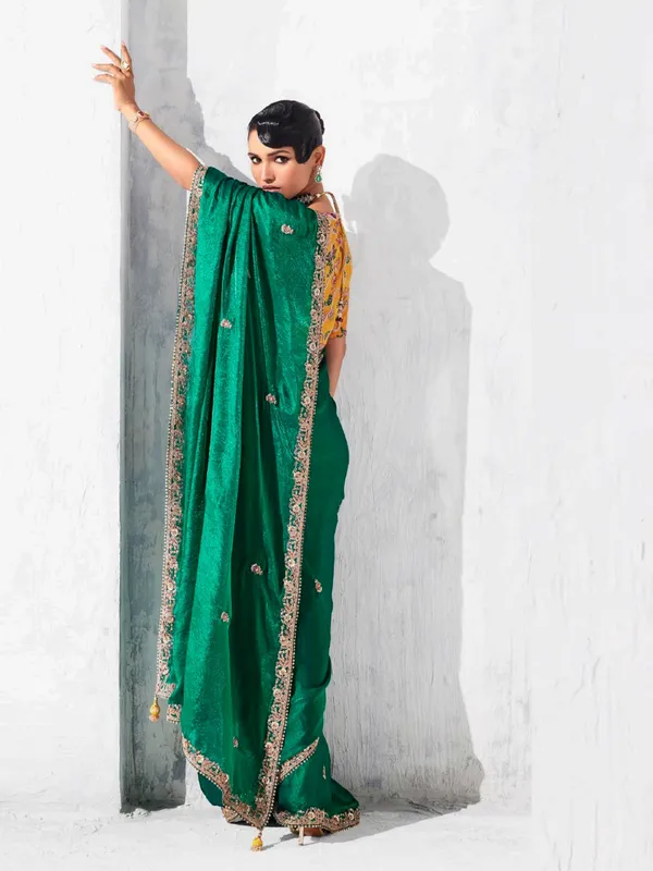 Green tissue silk saree embellished for festival wear