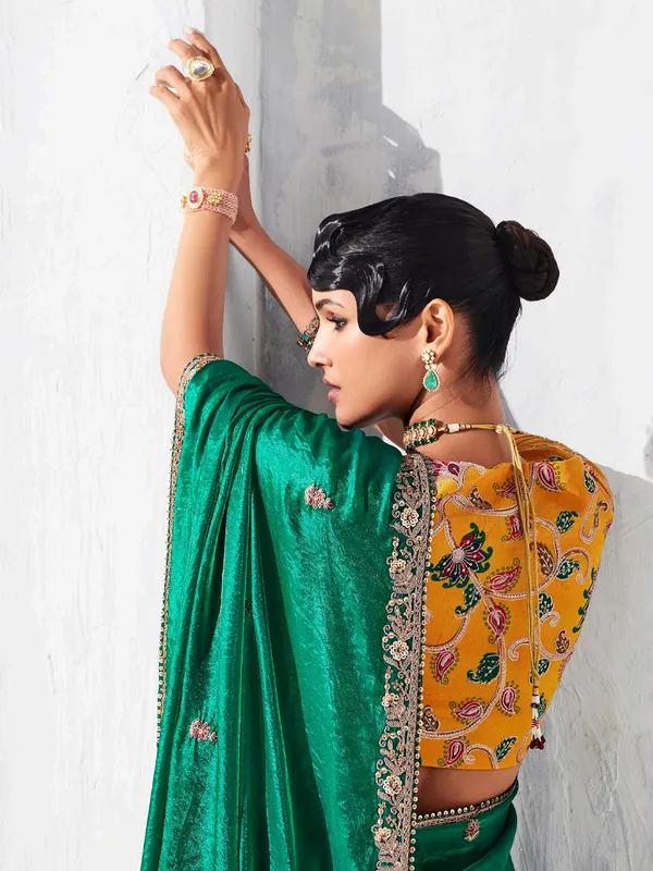 Green tissue silk saree embellished for festival wear
