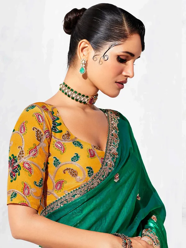 Green tissue silk saree embellished for festival wear
