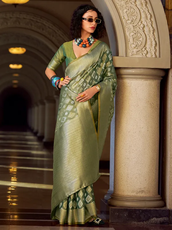 Green tissue silk saree with zari work