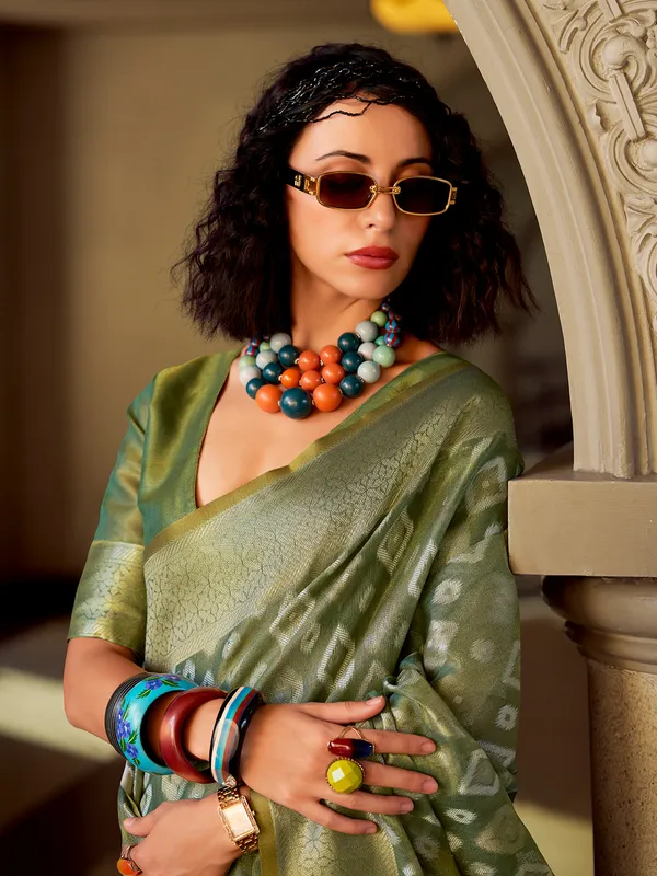 Green tissue silk saree with zari work