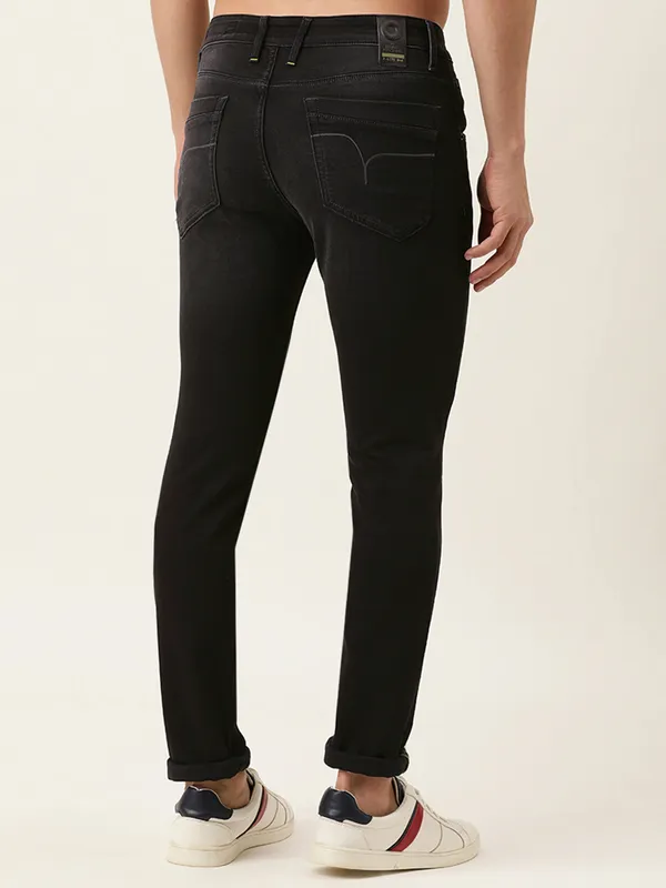 Grey colored denim jeans of flying machine