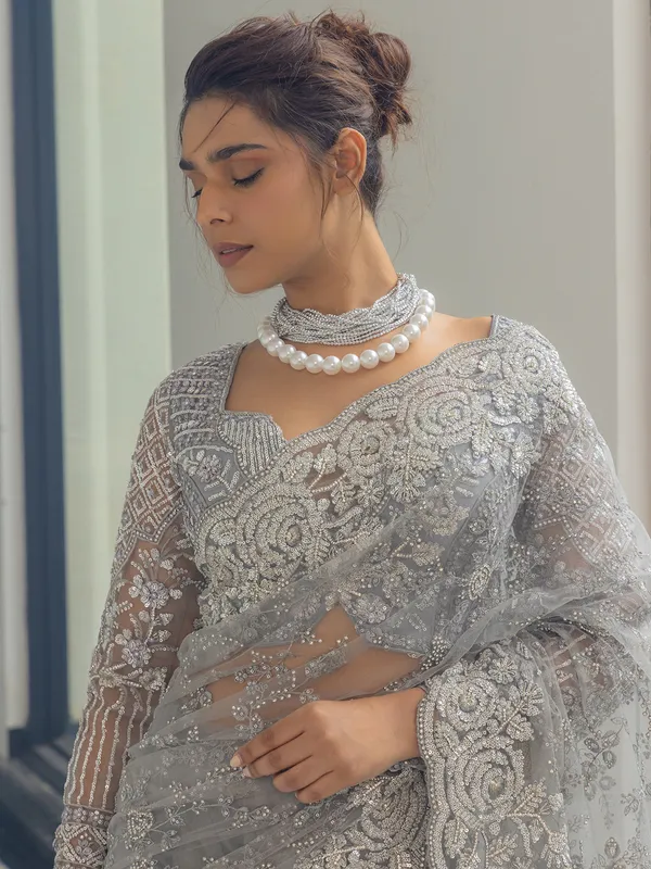 Grey net saree with sequins work