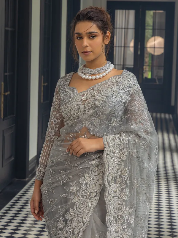 Grey net saree with sequins work