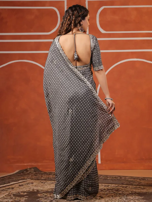 Grey printed saree in muslin for festive wear