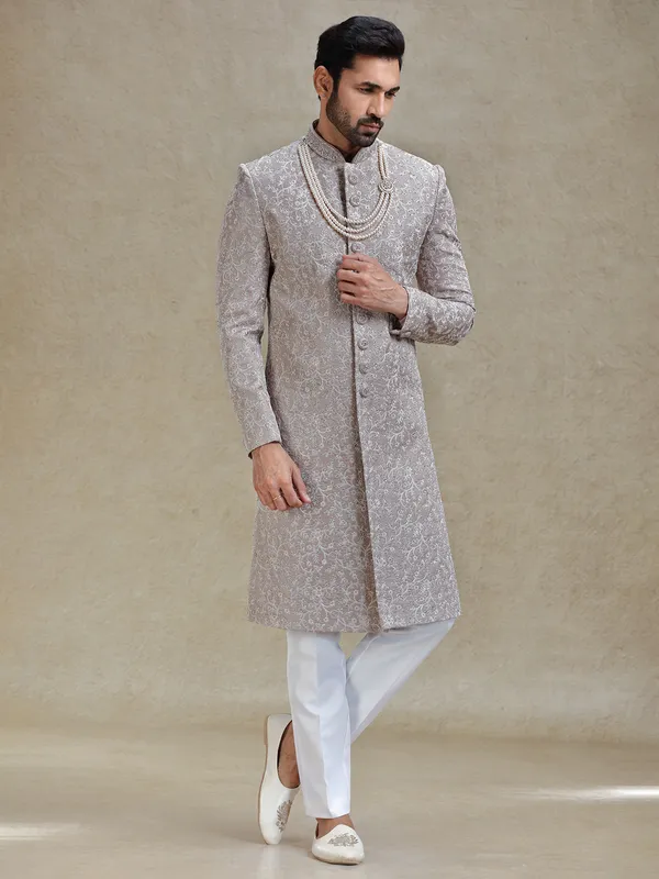 Grey silk sherwani in heavy stylish motifs