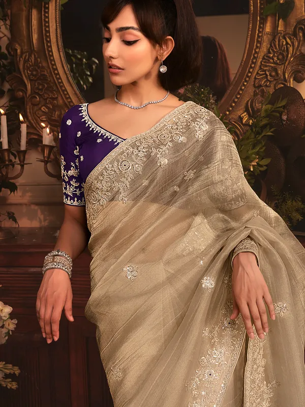 Grey tissue organza saree with purple blouse