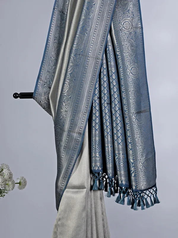 Grey tissue silk saree with zari border