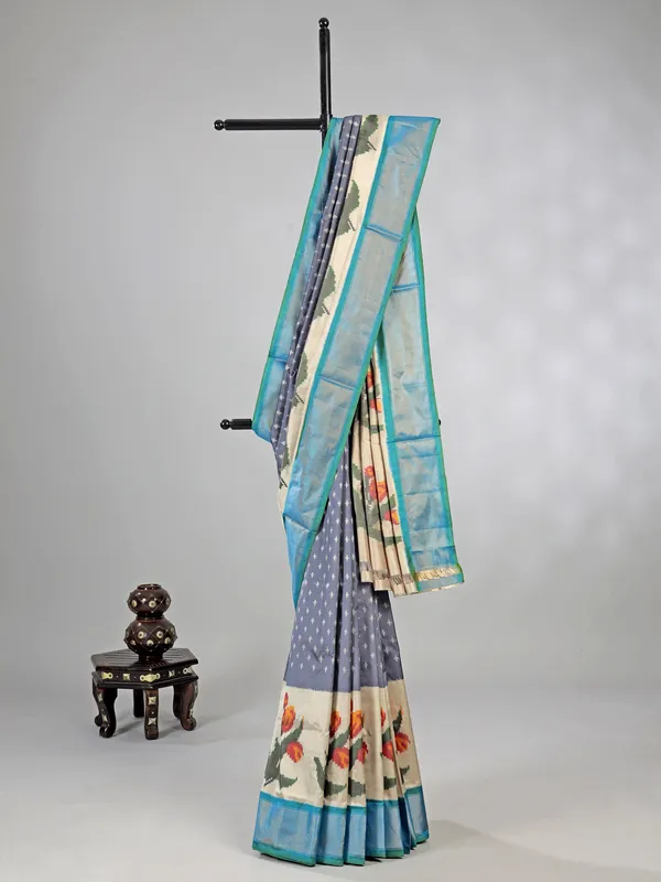 Grey zari weaving patola silk saree for royal occasions