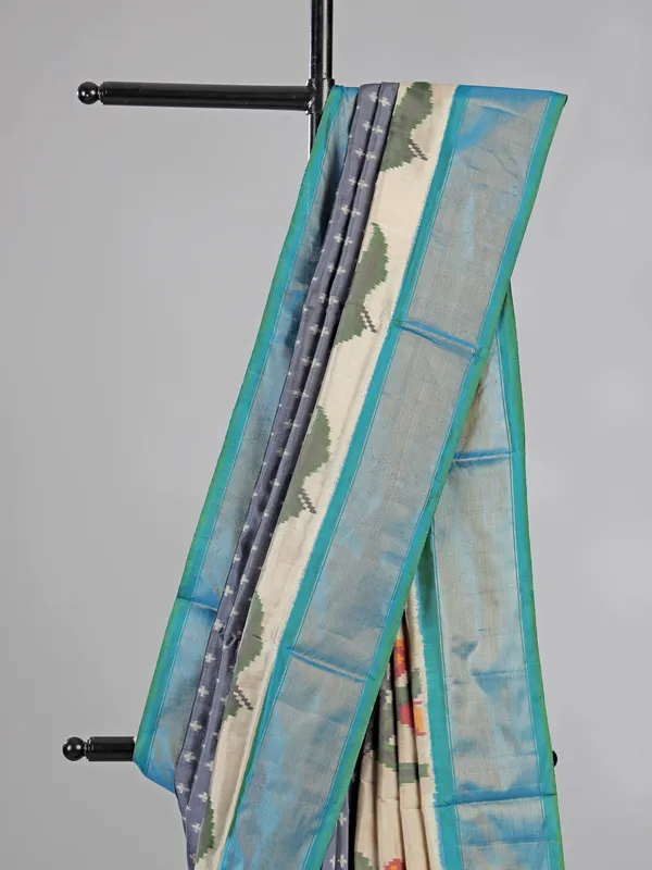 Grey zari weaving patola silk saree for royal occasions