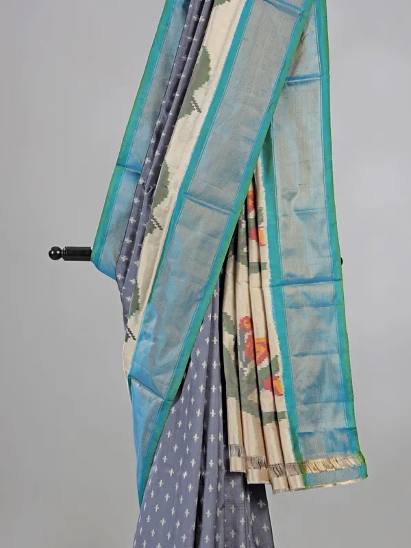 Grey zari weaving patola silk saree for royal occasions