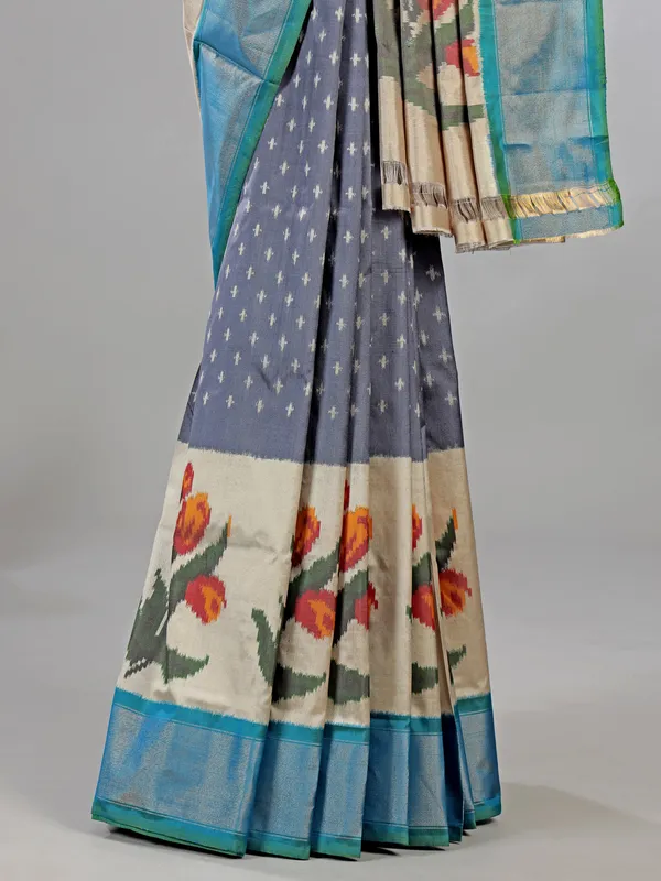 Grey zari weaving patola silk saree for royal occasions